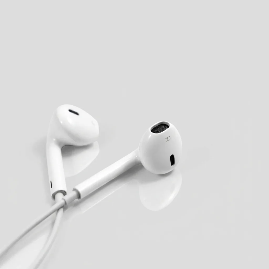 White earbuds on a light gray surface